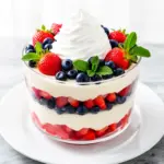 red white and blue cheesecake fruit salad - featured image